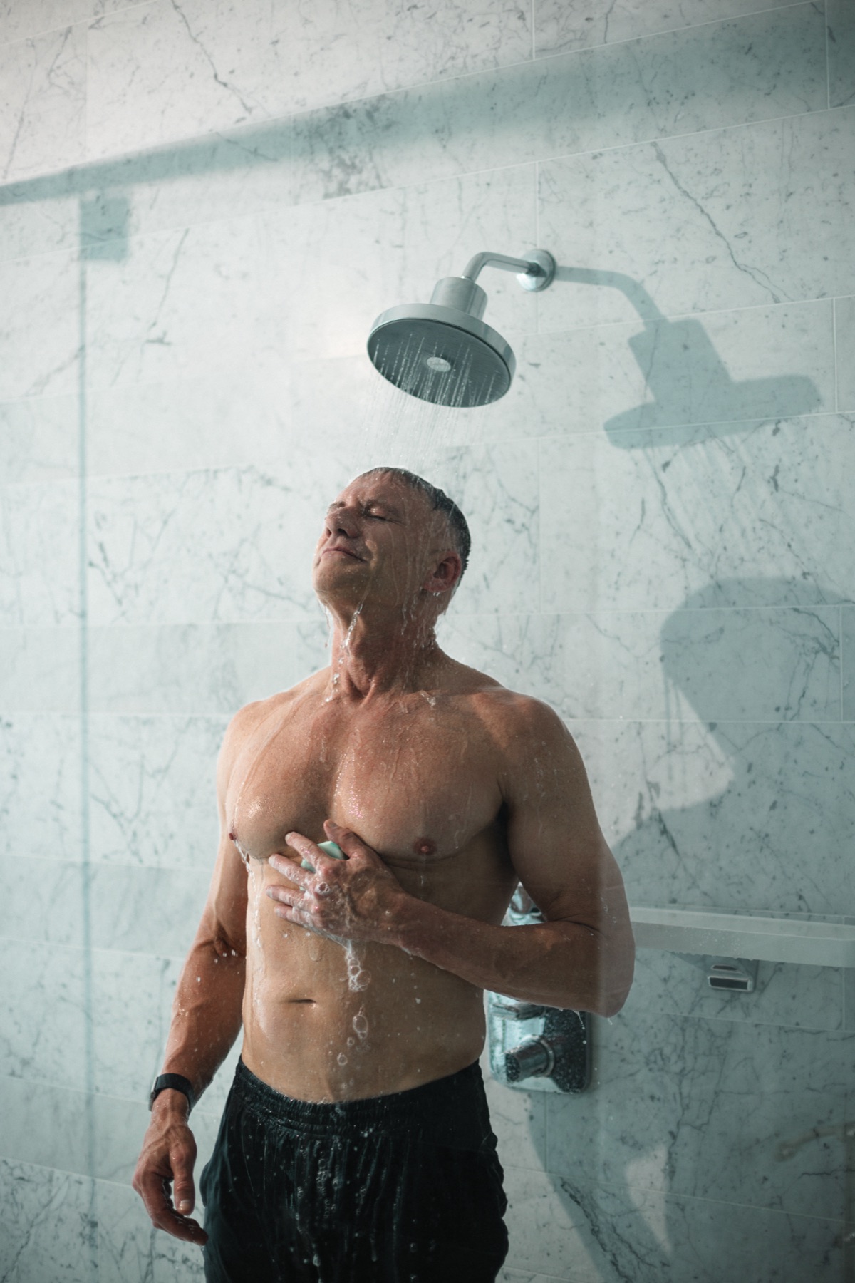 Gary Brecka under a Cold Life filtered showerhead